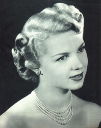 One popular hairstyle in the 40s was called a Victory Roll, in honor of the